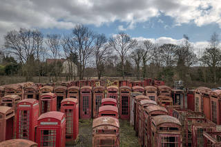 Disused phone booths at Unicorn Restorations in Redhill, England.