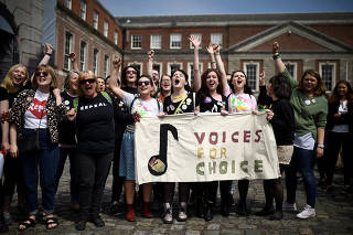 Women celebrate the result of yesterday's referendum on liberalizing abortion law, in Dublin