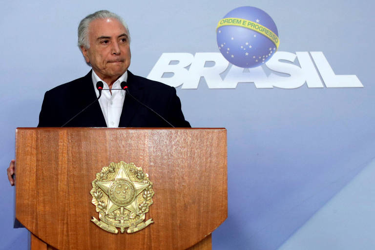 O presidente Michel Temer durante anÃºncio em BrasÃ­lia, neste domingo (27)