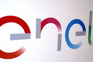 FILE PHOTO: The new logo of Italy's biggest utility Enel is seen inside its flagship store in downtown Milan