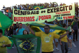 People attend a protest in support of the truck drivers' strike, calling for military intervention and against Brazil President Michel Temer's government in Brasilia