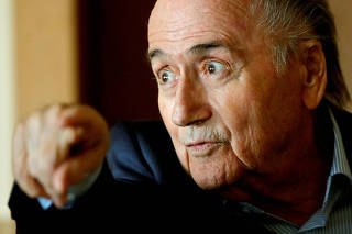 FILE PHOTO: Former FIFA President Sepp Blatter speaks with reporters in Zurich, Switzerland
