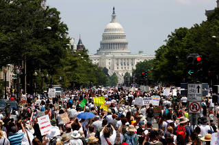 Immigration activists march to protest the Trump Administration's immigration policy in Washington