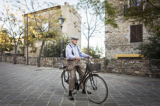 An 88-year-old man on his bicycle in Acciaroli, Italy.