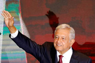 Mexico's next President Andres Manuel Lopez Obrador gestures to supporters, in Mexico City