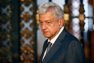 Mexico's president-elect Andres Manuel Lopez Obrador addresses the media after a private meeting with Mexico's President Enrique Pena Nieto at National Palace in Mexico City