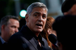 FILE PHOTO: Director Clooney is interviewed at the premiere for 