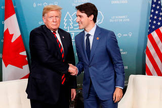 FILE PHOTO: U.S. President Donald Trump meets with Canada's Prime Minister Trudeau in the Charlevoix town of La Malbaie Quebec