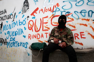 Demonstrator poses for a photo, as he takes part in the funeral service of Jose Esteban Sevilla Medina in Monimbo