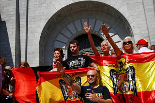 People attend a demonstration against plans to remove Franco from the Valle de los Caidos in San Lorenzo de El Escorial