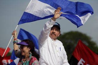 Nicaragua's President Daniel Ortega and Vice President Rosario Murillo arrive for an event to mark the 39th anniversary of the Sandinista victory over President Somoza in Managua