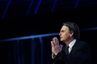 Federal deputy Jair Bolsonaro of the PSL, a pre-candidate for Brazil's presidential election, attends a debate in Brasilia