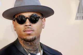 FILE PHOTO: Singer Chris Brown poses at the 2015 iHeartRadio Music Awards in Los Angeles
