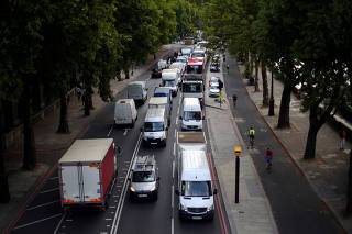 FILE PHOTO: Cars sit in a traffic jam along the Embankment during the morning rush hour in central London