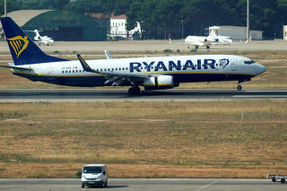 FILE PHOTO: A Ryanair Boeing 737 plane lands at the airport, during a protest on the second and last day of a cabin crew strike held in several European countries, in Valencia