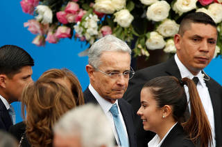 Colombia's former President Alvaro Uribe Velez arrives for the swear-in ceremony of Colombia's new President Ivan Duque at the Bolivar Square in Bogota