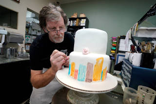 FILE PHOTO: Baker Jack Phillips decorates a cake in his Masterpiece Cakeshop in Lakewood