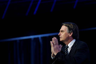 FILE PHOTO: Presidential candidate Jair Bolsonaro of the Party for the Social Liberal Party (PSL), attends a debate at the Industry Confederation event in Brasilia