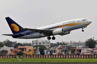 FILE PHOTO: A Jet Airways passenger aircraft takes off from the airport in Ahmedabad