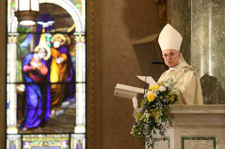 Archbishop Carlo Maria Vigano, reads during the episcopal ordination of Auxiliary Bishops James Massa and Witold Mroziewski, in Brooklyn, New York