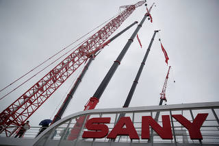 FILE PHOTO: A sign of Sany Group is seen at Bauma China 2016, the 8th International Trade Fair for Construction Machinery, in Shanghai