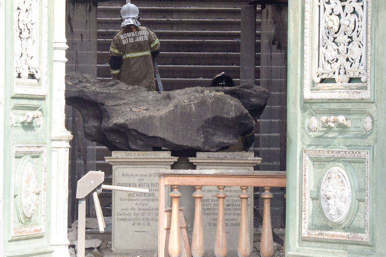 Firefighter working on what's left from the National Museum building