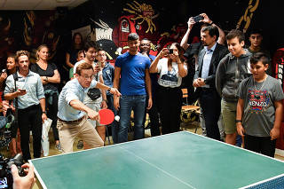 Moderate Party leader Ulf Kristersson plays table tennis as he visits the Flamman, a youth center in Hyllie, Malmo