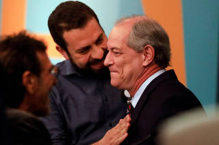Presidential candidates Ciro Gomes of the Democratic Labour party (PDT)  and Guilherme Boulos of the Socialism and Freedom Party (PSOL) talk during television debate at the Gazeta TV studio in Sao Paulo
