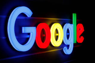 An illuminated Google logo is seen in Zurich