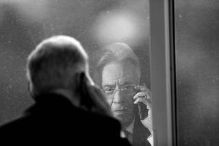 Brazil's former President Cardoso talks on the phone during an interview with Reuters in Sao Paulo