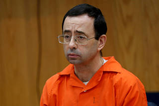 FILE PHOTO: Nassar listens to victims impact statements during his sentencing in the Eaton County Circuit Court in Charlotte
