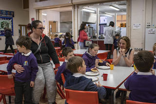 Siobhan Collingwood, head teacher of Morecambe Bay Primary School, joins students for breakfast at the school in Morecambe, England.