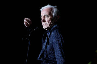 FILE PHOTO: French singer Charles Aznavour performs as part of Spring of Culture 2013 in Manama