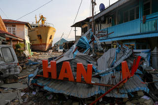 A ship is seen stranded on the shore after the earthquake and tsunami hit an area in Donggala
