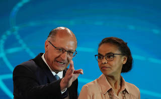 Presidential candidates Geraldo Alckmin talks with Marina Silva ahead of a televised debate in Rio de Janeiro