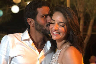 Lucy Aharish and Tsahi Halevi pose for a photo at their wedding party in Hadera