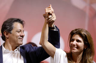 Presidential candidate Fernando Haddad of the Workers Party (PT) and his wife Ana Estela take part in a campaign rally in Sao Paulo