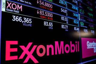 FILE PHOTO: A logo of Exxon Mobil is displayed on a monitor above the floor of the New York Stock Exchange shortly after the opening bell in New York