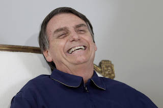 Presidential candidate Jair Bolsonaro attends a news conference at a campaign office in Rio de Janeiro