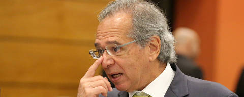 FILE PHOTO: Economist Paulo Guedes is seen before a lunch between businessmen and Federal deputy Jair Bolsonaro a candidate for the Presidency of the Republic for the PSL at the Federation of Industries of Rio de Janeiro (FIRJAN) headquarters in Rio de Janeiro, Brazil August 6, 2018. REUTERS/Sergio Moraes/File Photo ORG XMIT: SMS01