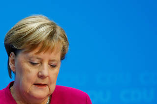 German Chancellor Angela Merkel attends a news conference following the Hesse state election in Berlin