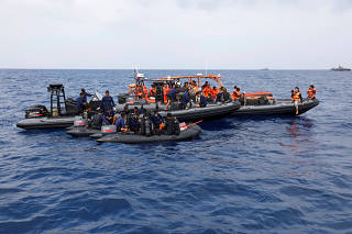Rescue team members prepare to dive near the location of the Lion Air flight JT610 crash during rescue operations off the north coast of Karawang regency