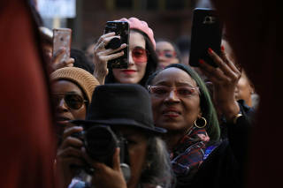 Stacey Abrams supporters take photos of the Democratic gubernatorial candidate for Georgia with their cell phones and cameras as she speaks to a crowd at the Atlanta Underground in Atlanta, Georgia