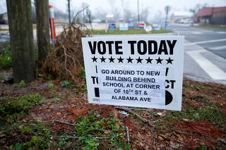 A sign directs voters to a new polling location where Hurricane Michael destroyed many schools and other buildings used as polling stations in the area in Lynn Haven