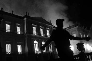 A policeman clears the area during a fire at the National Museum of Brazil in Rio de Janeiro