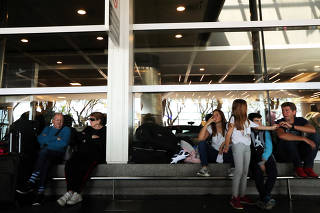 Passangers wait at Buenos Aires' airport as flights were cancelled during a strike by workers of Aerolineas Argentinas airline