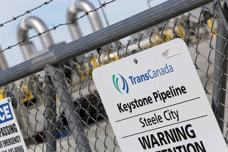 FILE PHOTO: A TransCanada Keystone Pipeline pump station operates outside Steele City, Nebraska