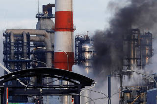 Smoke billows from a fire at oil refinery, owned by Russian oil producer Gazprom Neft, in Moscow