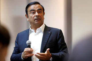 FILE PHOTO:Carlos Ghosn, chairman and CEO of the Renault-Nissan-Mitsubishi Alliance, responds to a question on the alliance's new venture capital fund during roundtable with journalists at the 2018 CES in Las Vegas