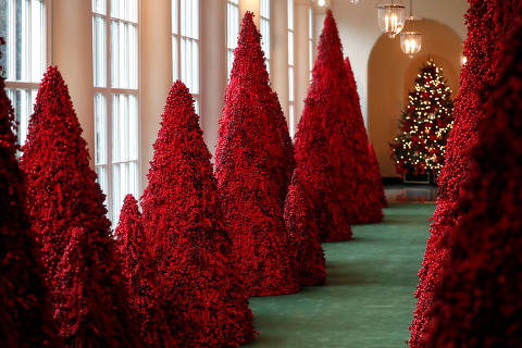 Trees made from red berries line the East Colonnade during the 2018 Christmas Press Preview at the White House in Washington, U.S., November 26, 2018. REUTERS/Leah Millis ORG XMIT: WAS504